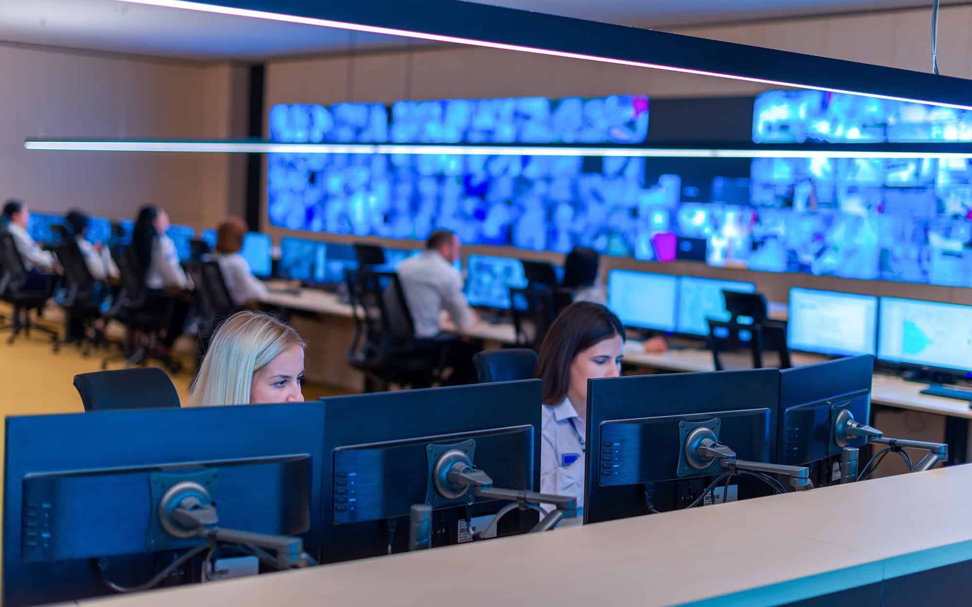 Security Operations Center with Operators Looking at Monitors