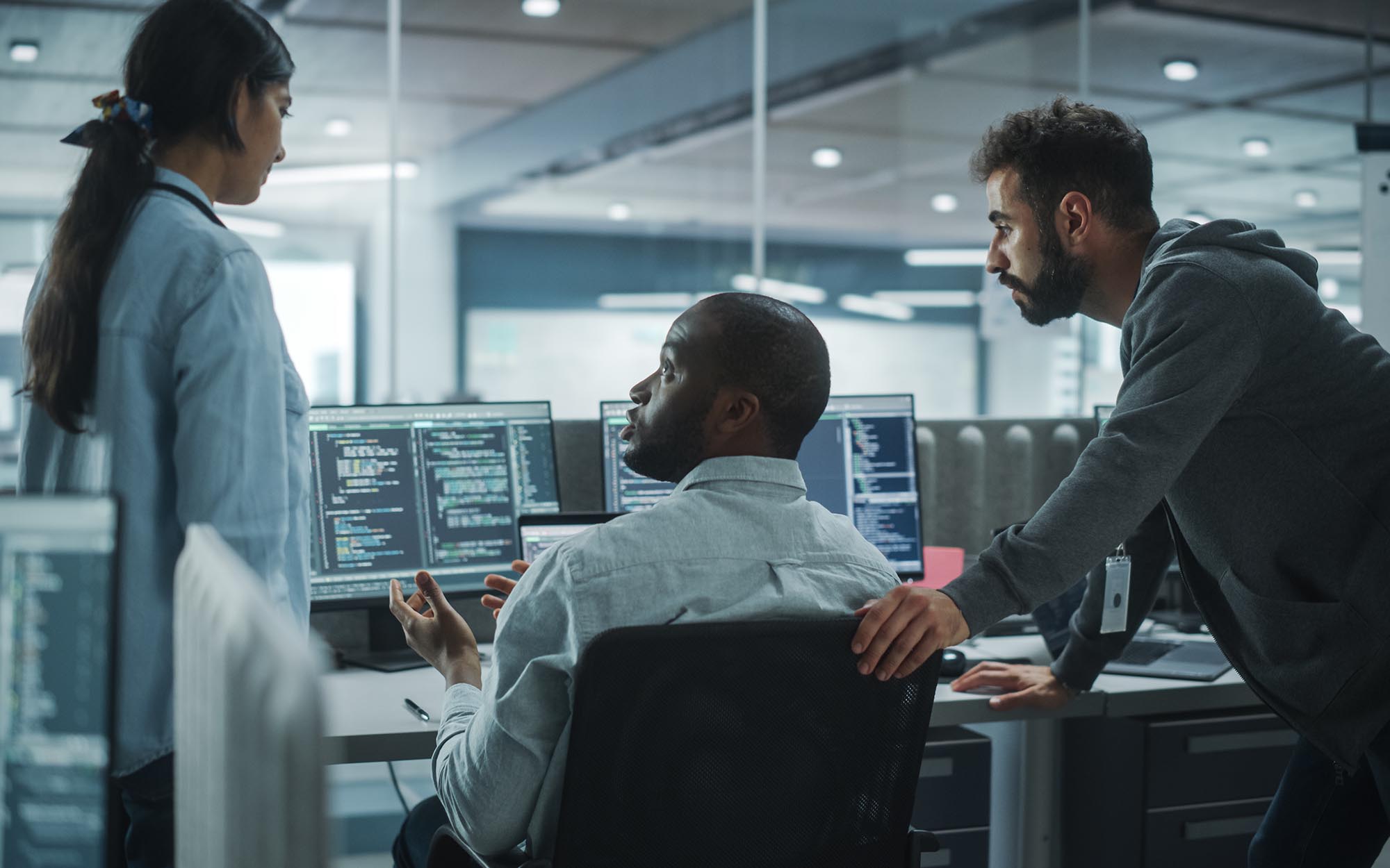 Workers looking at computer