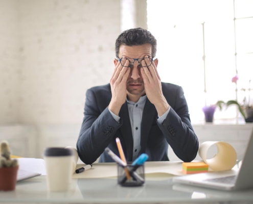 Business person stressed at computer